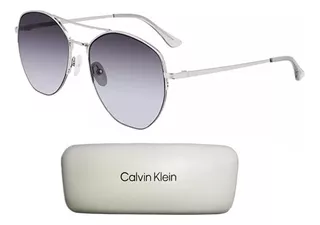 Calvin Klein ® Lentes De Sol 100% Protecc Uv Ck20121s 109 Ev Color De La Lente Degradado Color De La Varilla Plateado Color Del Armazón Plateado Diseño Redondo