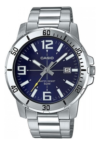 Reloj pulsera Casio MTP-VD01 con correa de acero inoxidable color plateado - fondo azul oscuro
