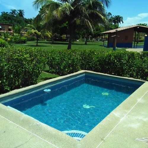 Imagen 7 de 10 de Villa 100% Operativa Con Aire Central, Piscina Privada Y Area De Parrilla De La Villa, Adicionalmente El Conjunto Residencial Posee En La Áreas Comunes Piscina, Areas Verdes Y Churuata.
