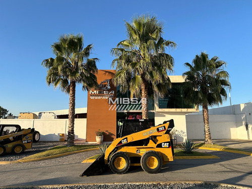 Minicargador Caterpillar/bobcat