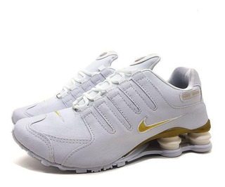 nike shox junior dourado