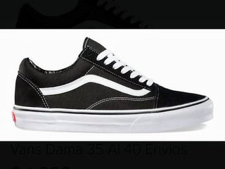 vans negras y celestes