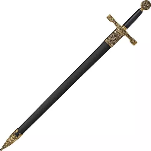 Uma espada dourada com um desenho dourado na frente.