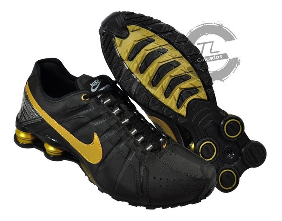 nike shox junior dourado