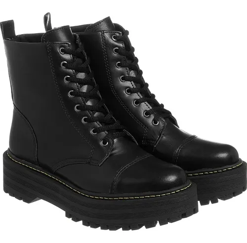 Coturno tratorado cheap feminino