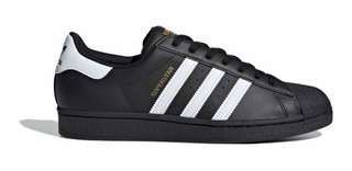 zapatillas adidas negras y doradas