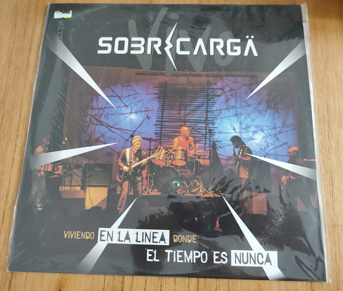 La Sobrecarga - Viviendo En La Linea.... Estándar