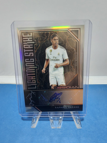 Barajita Panini Autografiada Por Raphaël Varane. Real Madrid