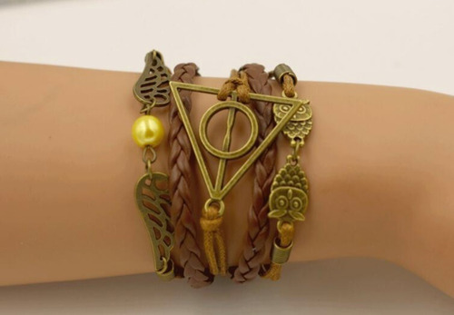 Imagem 4 de 5 de Pulseira Harry Potter Berloque Pomo Ouro Relíquias Da Morte