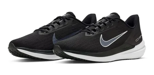 Tenis nike con la palomita 2025 dorada