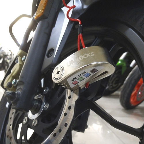 Imagen 9 de 10 de Combo Traba Disco Con Alarma + Cable Recordatorio Um Locks