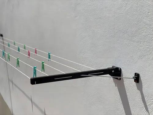 Tendedero de pared retráctil, plegable y articulado, negro