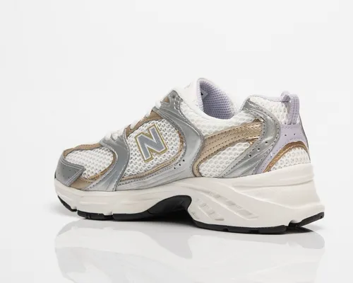 New balance gris hombre dorado sale