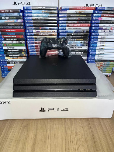 Playstation 4 Pro 1tb Ps4 Pro 1 Controle + 2 Jogos + 1 Quadro Decorativo Preto (Recondicionado)