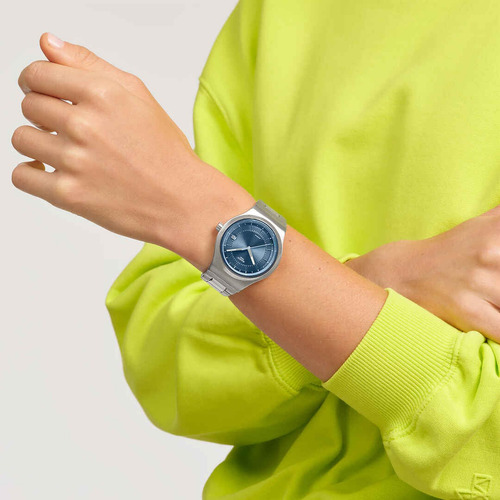 Reloj Swatch Sistem51 Shimmer At Dusk Automatic Yis435g Malla Plateado Bisel Plateado Fondo Azul Claro