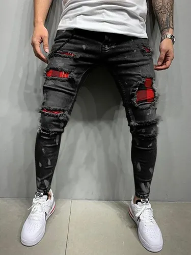 Pantalon negro rasgado hombre new arrivals