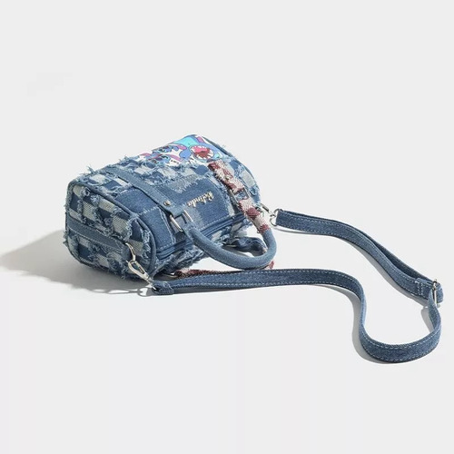 - Para A Bolso De Mezclilla Stitch Con Costuras Rasgadas /