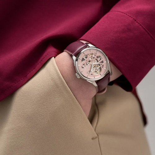 Reloj Hamilton Jazzmaster Skeleton Lady H32265870 Correa Violeta Bisel Plateado Fondo Rosa
