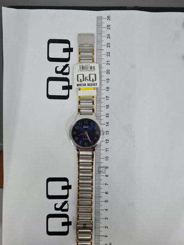 Reloj Q&q Q16a-506py Hombre Pulsera Correa Plateado-dorado Fondo Azul Q16a-506py