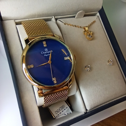 Imagem 1 de 5 de # Relógio Champion Feminino Dourado Com Fundo Azul Barato