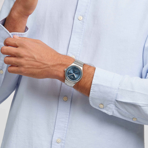 Reloj Swatch Sistem51 Shimmer At Dusk Automatic Yis435g Malla Plateado Bisel Plateado Fondo Azul Claro