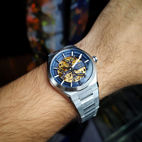Relógio Orient Automático Skeleton Nh7ss006 D1sx Correia Prateado Bisel Prateado Fundo Azul/dourado
