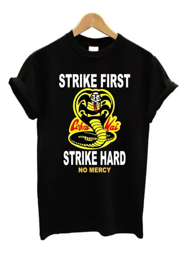 Remera Cobra Kai Strike First, Strike Hard, 100% Unisex