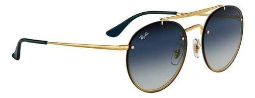 Anteojos de sol Ray-Ban Round Blaze Round Double Bridge Standard con marco de metal color matte gold, lente blue degradada/espejada, varilla gold de metal - RB3614N