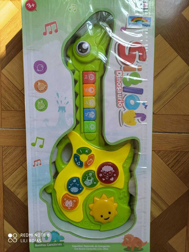 Imagen 1 de 3 de Guitarra Dinosaurio Bebé Niño Juguete Musical Y Luz Interact