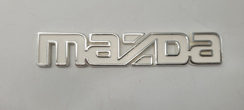 Mazda 323 Emblema Persiana 