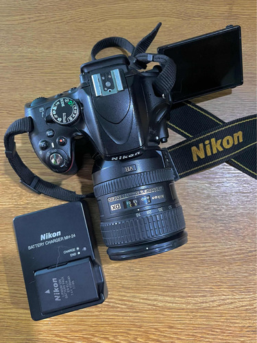 Nikon D5100 + Af-s Nikkor 16-85mm + Flash Sb-700 + Cargador