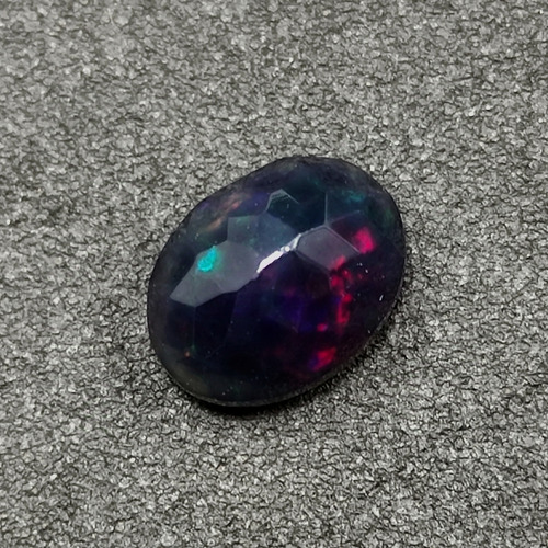 Ópalo Negro Nebuloso Iridiscente 8x6.20mm. 1.20ct.