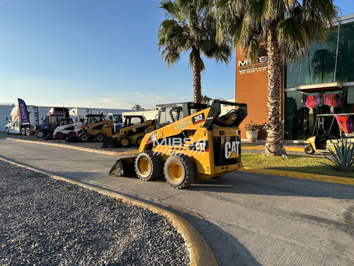 Minicargador Caterpillar/bobcat