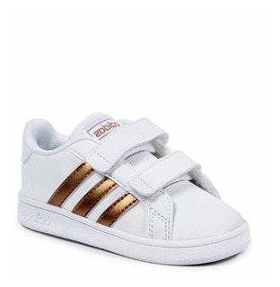 botines adidas blancos y dorados