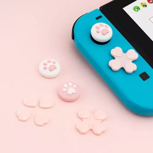 Uma consola de jogos nintendo com uma capa rosa e azul.