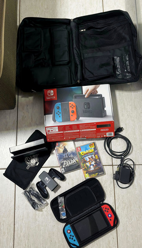 Console Nintendo Switch V1 32gb + 2 Jogos Originais + Mochila Case Película Acessórios Completos Azul-vermelho