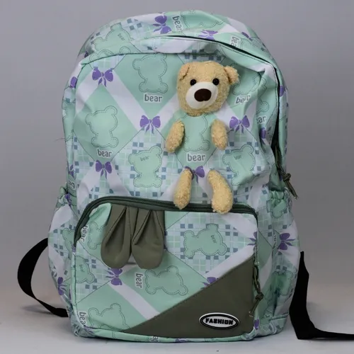 Mochila Infantil Peluche, Porta Botella Y Bolsillos De Tela Color Verde Claro Diseño De La Tela Patrones