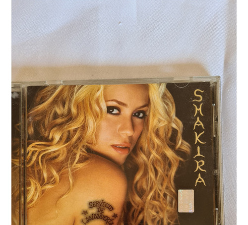 Cd Shakira - Servicio De Lavanderia 