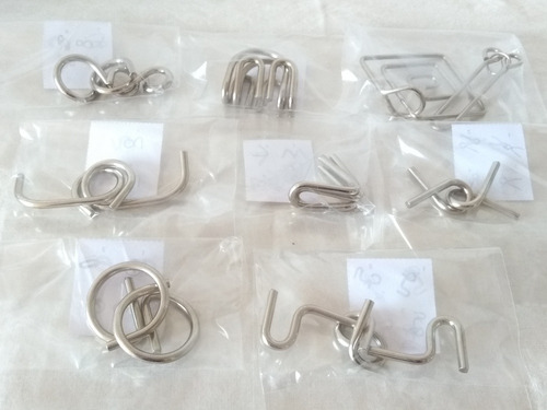 Imagem 1 de 4 de Kit Quebra Cabeça Metal 3d Enigma Com 8 Peças Steel Puzzles