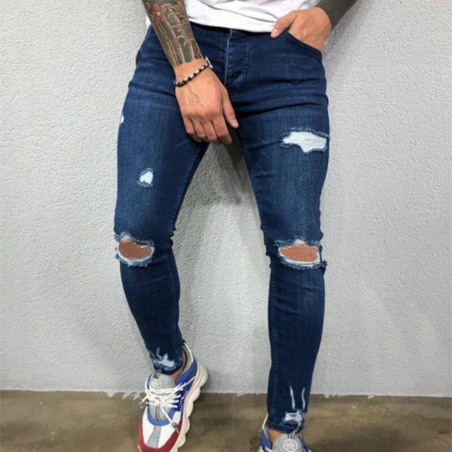 Vaqueros A La Moda Con Piernas Ajustadas Y Elásticas Rasgada