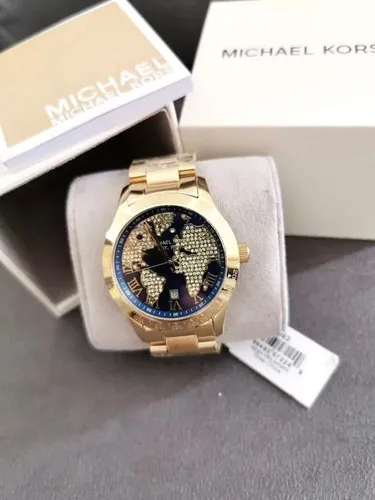 Relogio michael kors dourado fundo azul sales