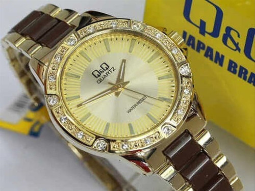 Reloj Para Dama Con Un Lindo Diseño Q&q Original