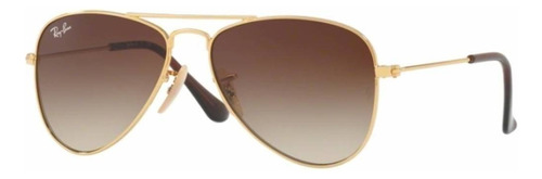 Óculos de sol Ray-Ban Aviador Junior 8-12 anos armação de metal cor polished gold, lente brown de plástico degradada, haste polished gold de metal - RJ9506S