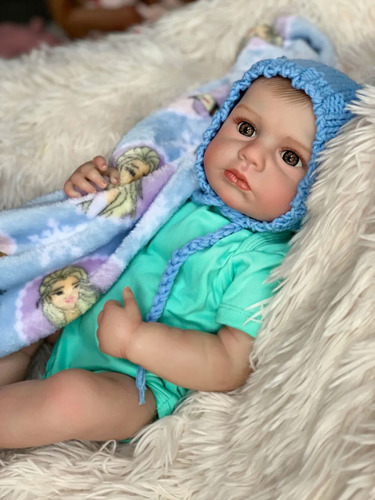 boneca bebe reborn menino 100% Silicone Pele e Cabelo e vasos sanguíneos pintados em 3D 46CM baby Pode Dar Banho Usando um chapéu e um macacão azul Com Acessórios Noveve Original