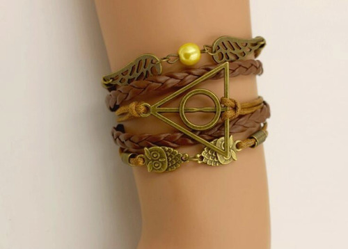 Imagem 2 de 5 de Pulseira Harry Potter Berloque Pomo Ouro Relíquias Da Morte