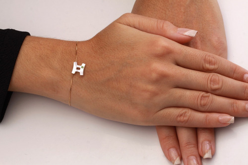 Imagem 2 de 2 de Pulseira Signo Em Madrepérola E Uma Zircônia Em Ouro 10k
