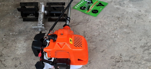Imagem 2 de 5 de Garantia De 1 Ano Nakasaki 3 Hp 63 Cc. Rocadeira Com Enxada.