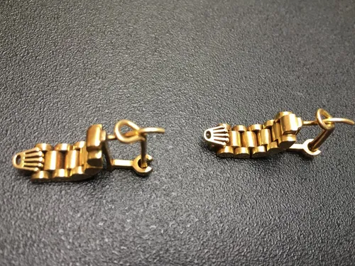 Aretes de oro rolex sale