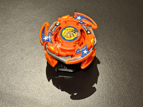 Trygle Beyblade Bakuten Takara Tomy Naranja
