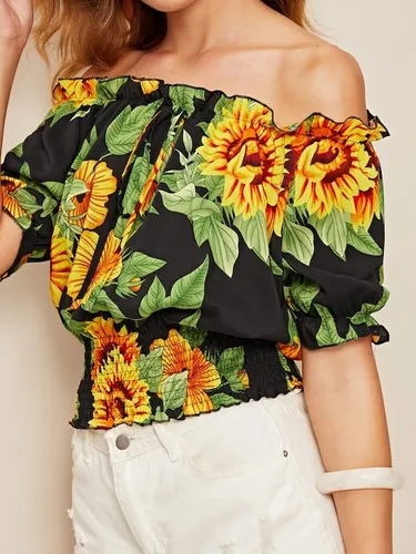 Blusas negras con girasoles 2025